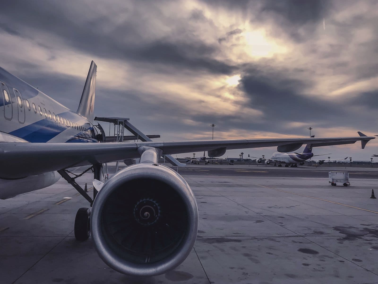 Narrow-body passenger aircraft on a runway prepared for charter departure.